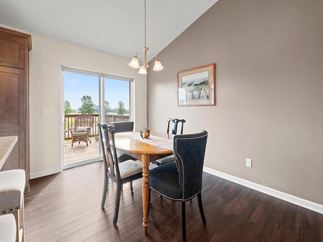 dining room with lofted ceiling, a chandelier, and dark hardwood / wood-style flooring