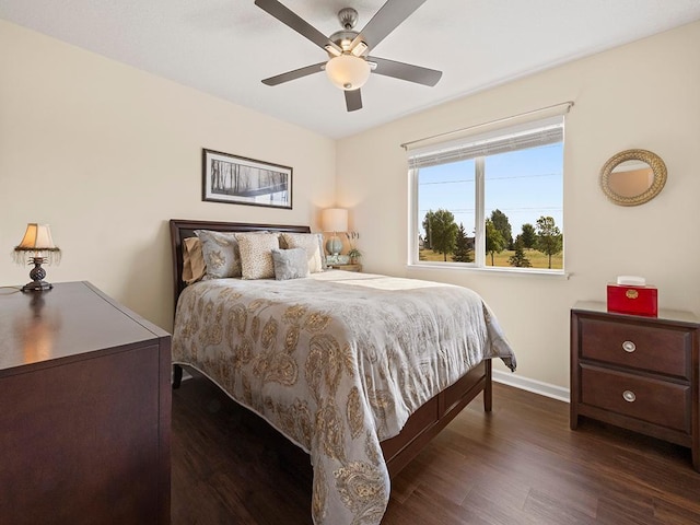 bedroom featuring ceiling fan and dark wood-type flooring