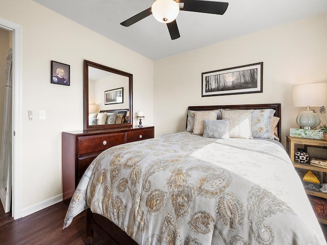 bedroom with ceiling fan and dark hardwood / wood-style flooring