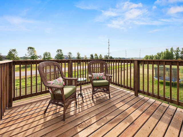 deck featuring a lawn