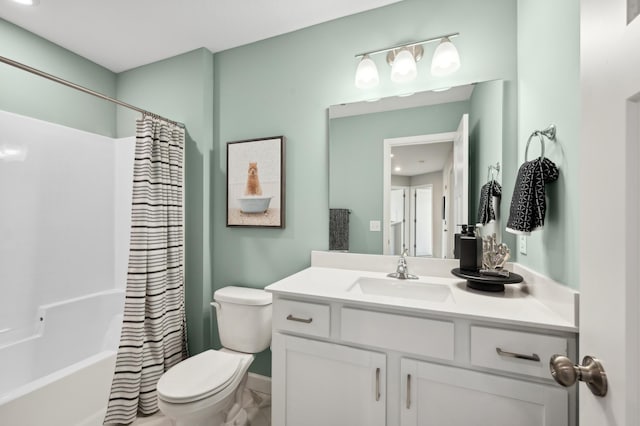 full bathroom featuring shower / bath combo, toilet, and vanity