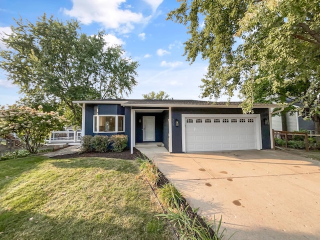 single story home featuring a front yard and a garage