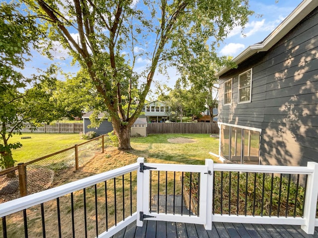 deck featuring a shed