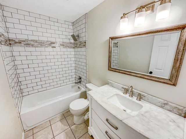 full bathroom with toilet, tile patterned flooring, vanity, and tiled shower / bath