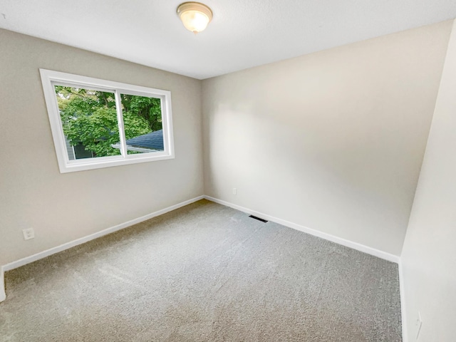 empty room featuring carpet floors