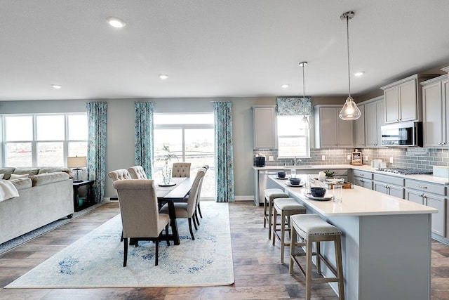 dining area featuring light hardwood / wood-style flooring and sink