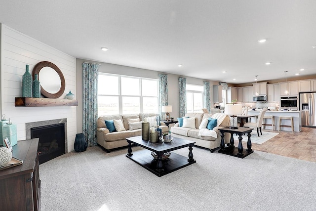 carpeted living room with a fireplace