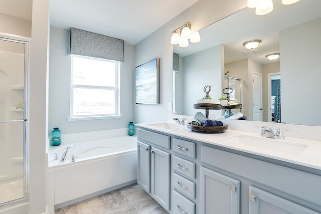 bathroom featuring separate shower and tub and vanity