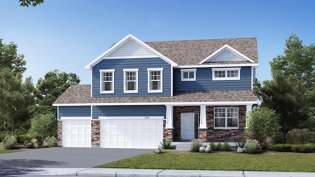 view of front of home featuring a front lawn and a garage