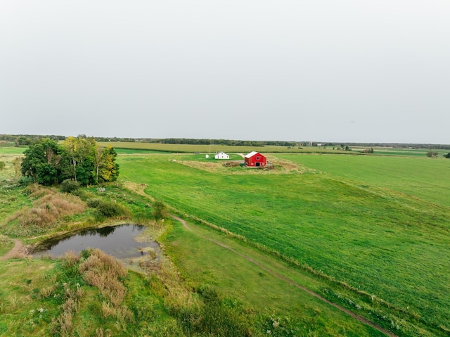 drone / aerial view with a water view and a rural view