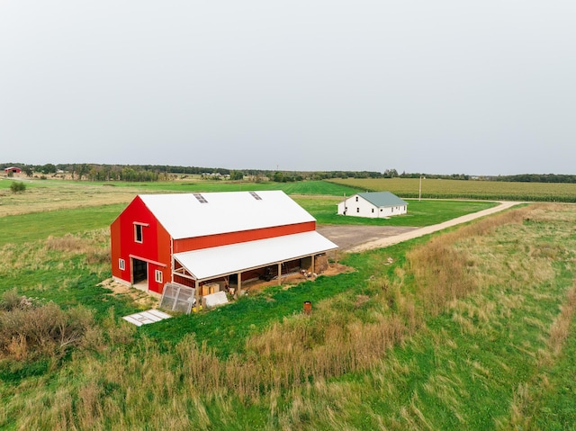 birds eye view of property featuring a rural view