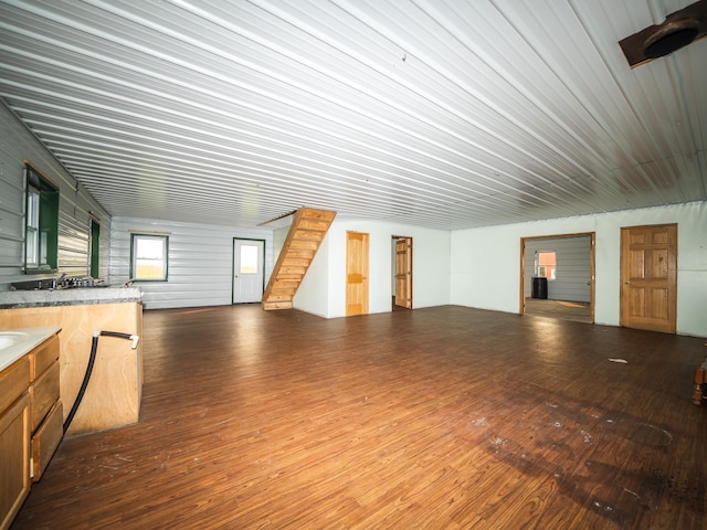 bonus room with dark hardwood / wood-style floors