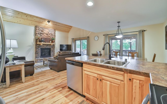 6334 Wilderness Rd Unit 31, Pequot Lakes, MN 56472 - kitchen featuring a stone fireplace, a sink, stainless steel dishwasher, and a wealth of natural light
