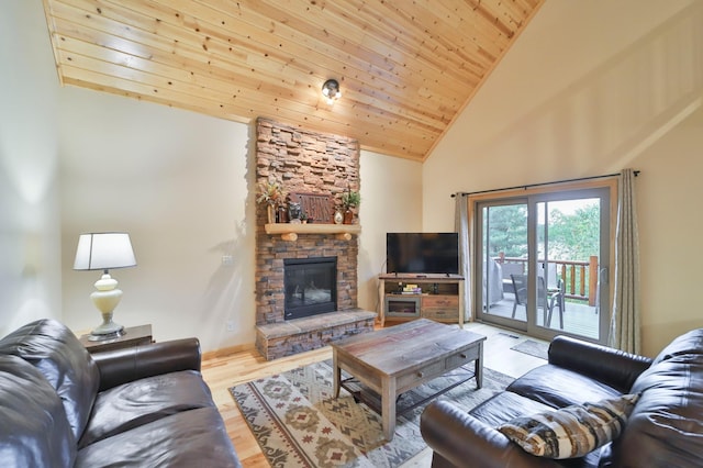 living room with wooden ceiling, light hardwood / wood-style floors, a stone fireplace, and high vaulted ceiling