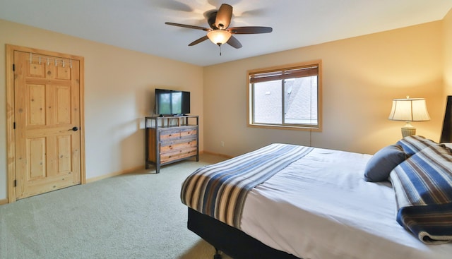 bedroom featuring ceiling fan and light colored carpet