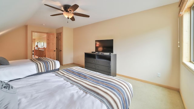 carpeted bedroom featuring vaulted ceiling and ceiling fan