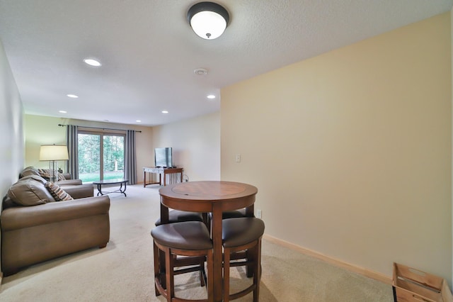 living room featuring light carpet