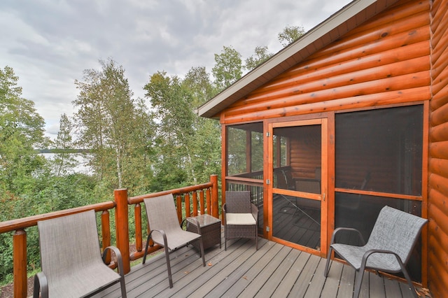 6334 Wilderness Rd Unit 31, Pequot Lakes, MN 56472 - wooden deck featuring a sunroom