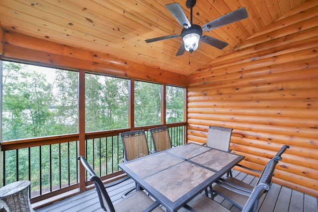 unfurnished sunroom with wood ceiling, a wealth of natural light, vaulted ceiling, and ceiling fan