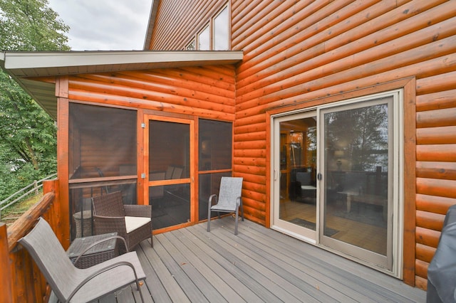 6334 Wilderness Rd Unit 31, Pequot Lakes, MN 56472 - deck featuring a sunroom