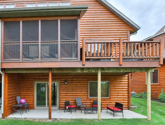 6334 Wilderness Rd Unit 31, Pequot Lakes, MN 56472 - back of house featuring an outdoor hangout area, a patio area, log veneer siding, and a balcony