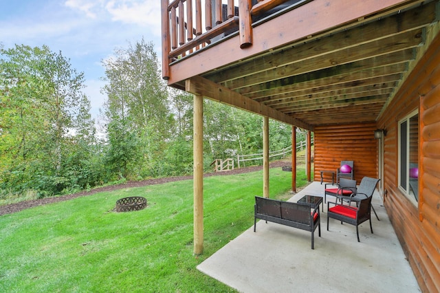 view of yard with a patio and an outdoor fire pit