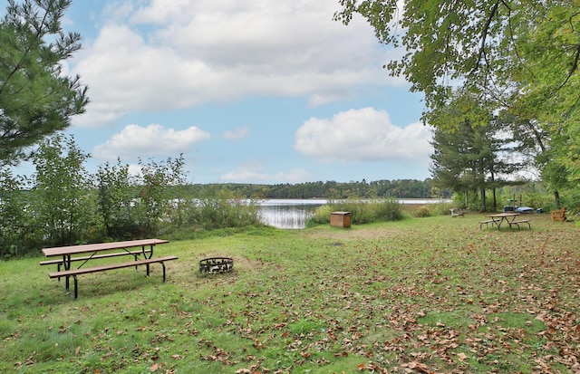 6334 Wilderness Rd Unit 31, Pequot Lakes, MN 56472 - view of yard featuring a water view and an outdoor fire pit