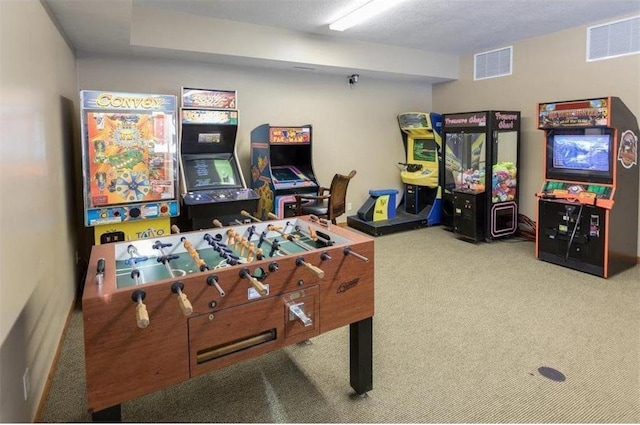 game room with carpet floors and a textured ceiling