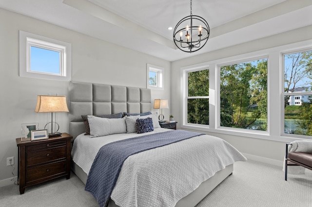 bedroom with multiple windows and an inviting chandelier