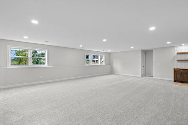 basement with light colored carpet