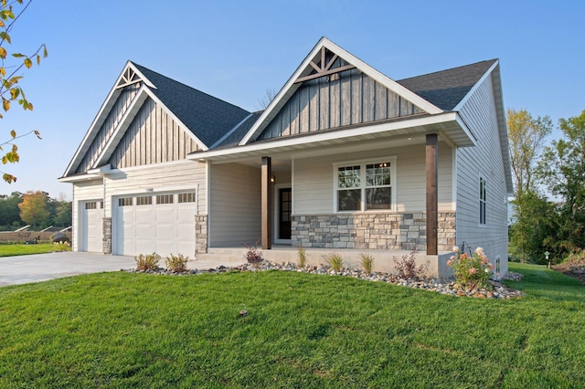 view of front facade featuring concrete driveway, an attached garage, board and batten siding, stone siding, and a front lawn