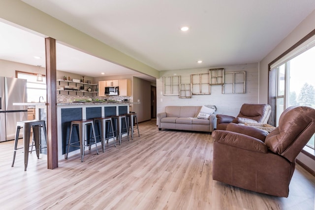 living room with recessed lighting and light wood-type flooring