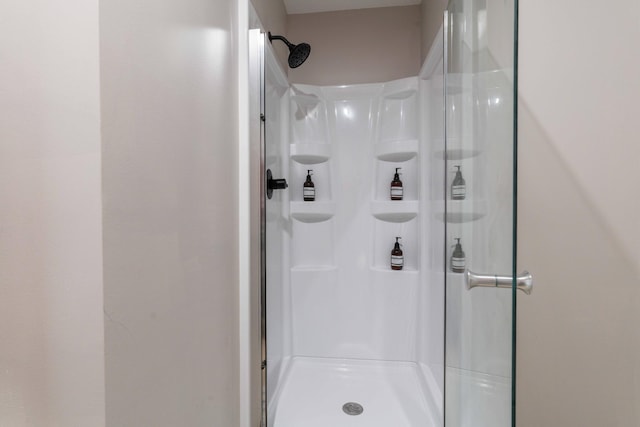 bathroom featuring a shower stall