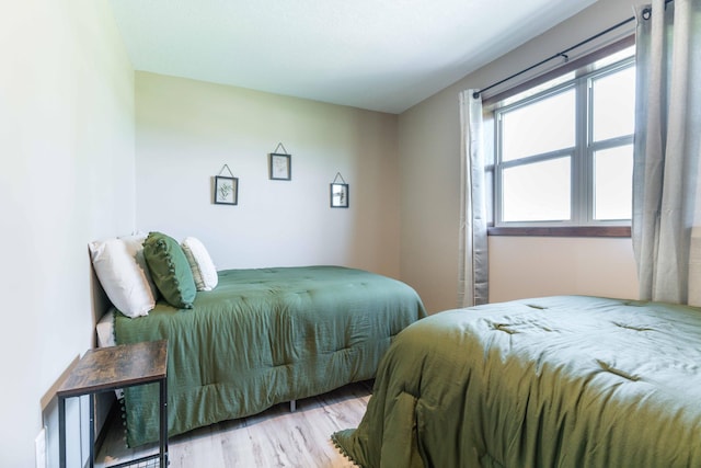 bedroom featuring wood finished floors