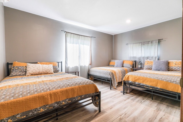 bedroom featuring wood finished floors