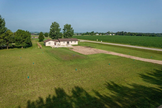 birds eye view of property with a rural view