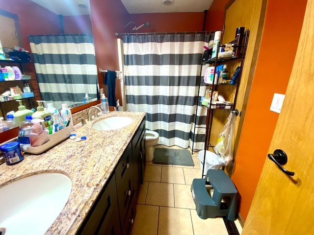 bathroom with a shower with shower curtain, tile patterned flooring, toilet, and vanity