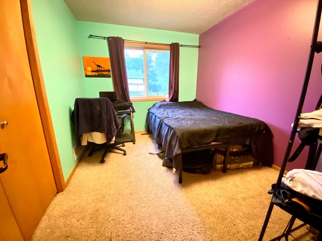 carpeted bedroom featuring a textured ceiling and pool table