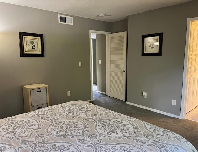 carpeted bedroom featuring a closet