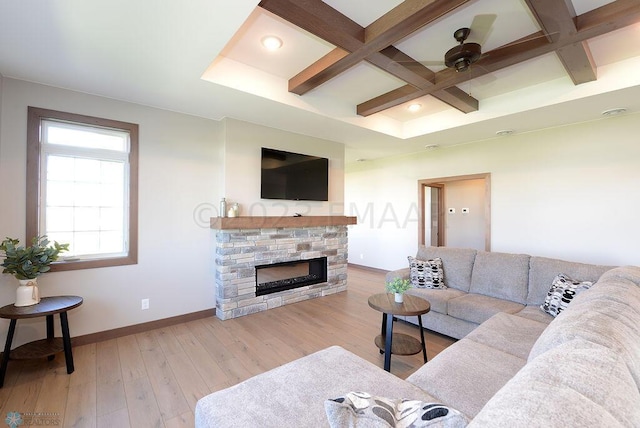 living area with beam ceiling, a fireplace, hardwood / wood-style floors, baseboards, and coffered ceiling