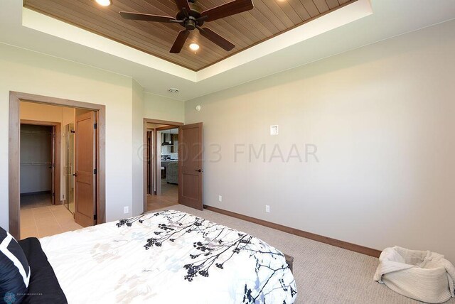 bedroom featuring baseboards, recessed lighting, light colored carpet, a raised ceiling, and wood ceiling