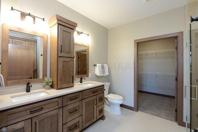 bathroom with tile patterned flooring, toilet, and vanity