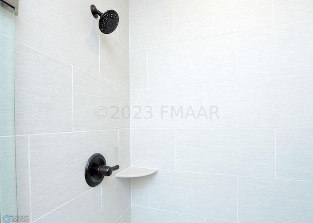 details with a tile shower