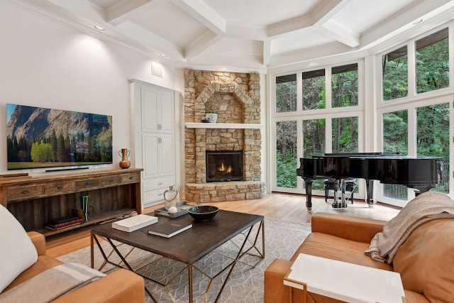 living room with light hardwood / wood-style floors, a wealth of natural light, and coffered ceiling