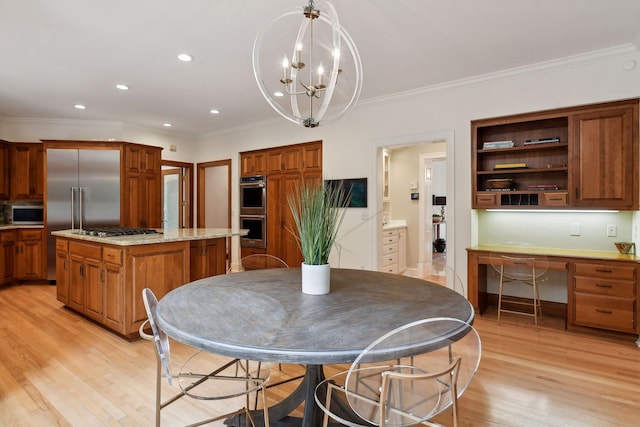 kitchen with stainless steel appliances, decorative light fixtures, light hardwood / wood-style flooring, a chandelier, and a center island