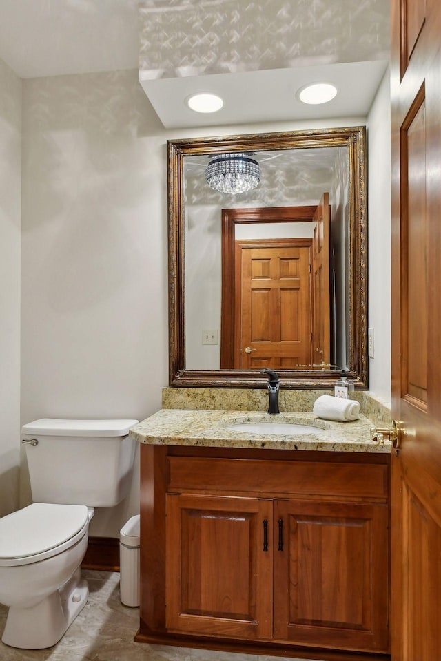 bathroom featuring vanity and toilet