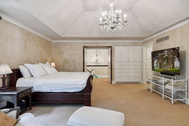 bedroom featuring a raised ceiling, carpet floors, and an inviting chandelier