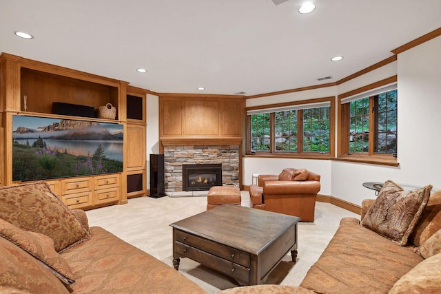 living room with light colored carpet, a stone fireplace, and crown molding