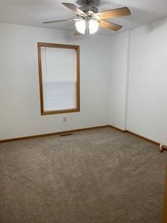 spare room featuring carpet flooring and ceiling fan