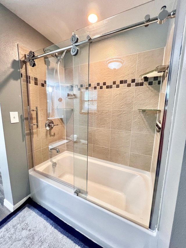 bathroom featuring enclosed tub / shower combo